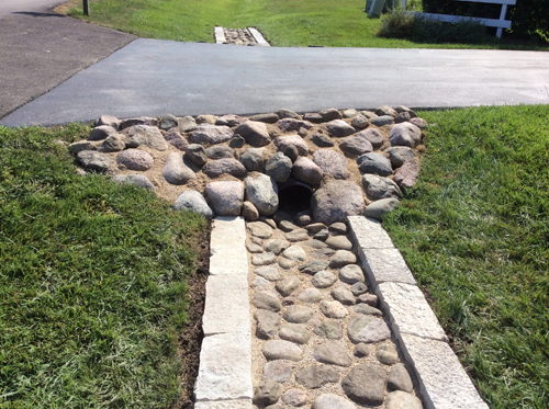 CULVERT ROCK INSERT ALONG DRIVEWAY