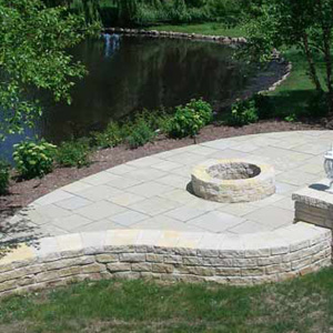 FIRE-PIT WITH UNILOCK BORDER WALL NEAR POND IN CRYSTAL LAKE, ILLINOIS
