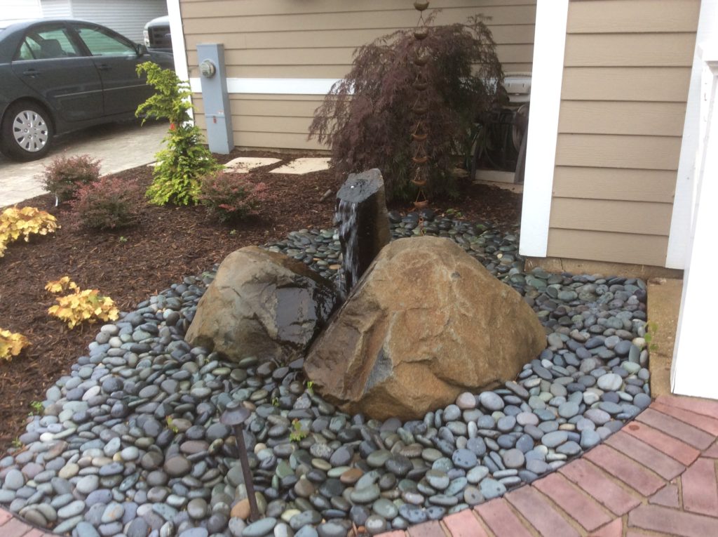 WATER FEATURE WITH LARGE AND SMALL ROCKS