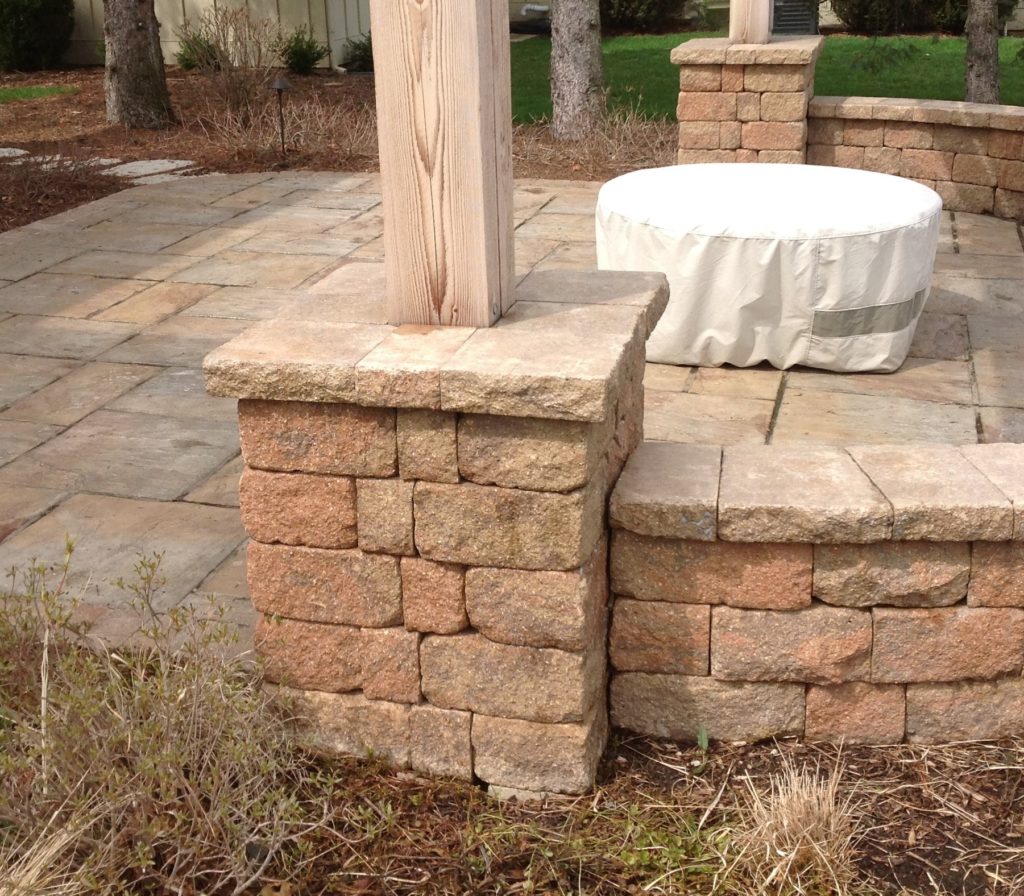 BROWN PERGOLA BUILT IN A PILLAR USING UNILOCK