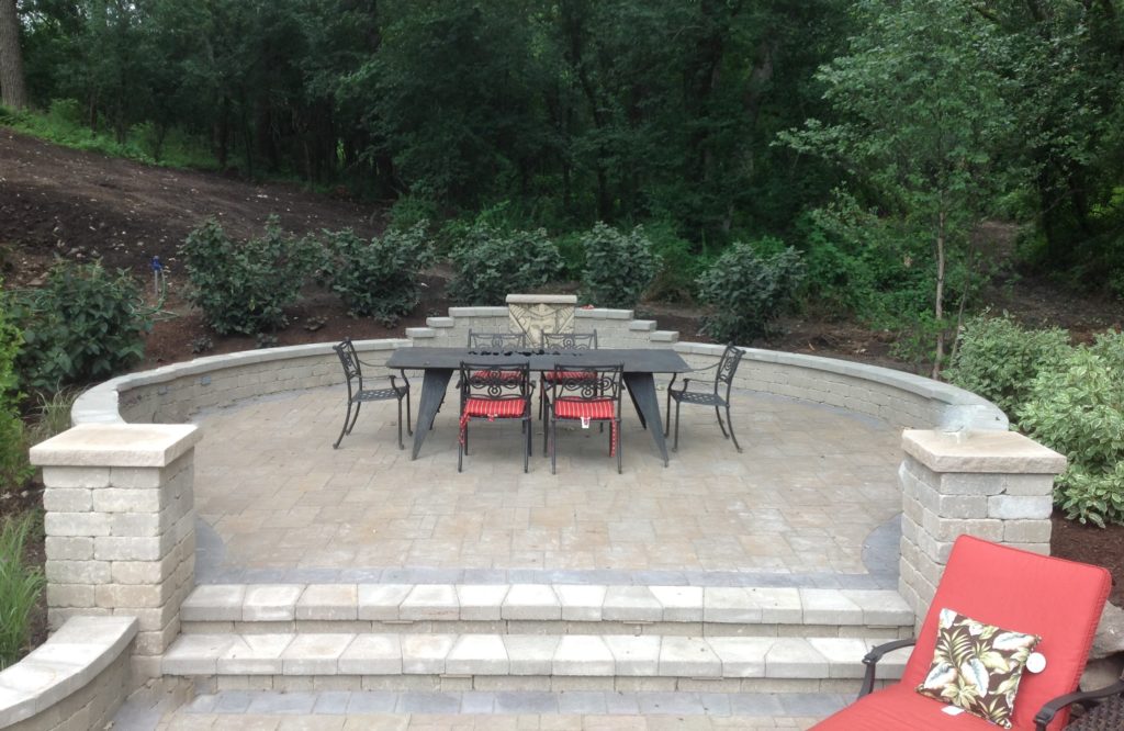 OUTDOOR DINNER AREA WITH FIRE COMING FROM THE TABLE