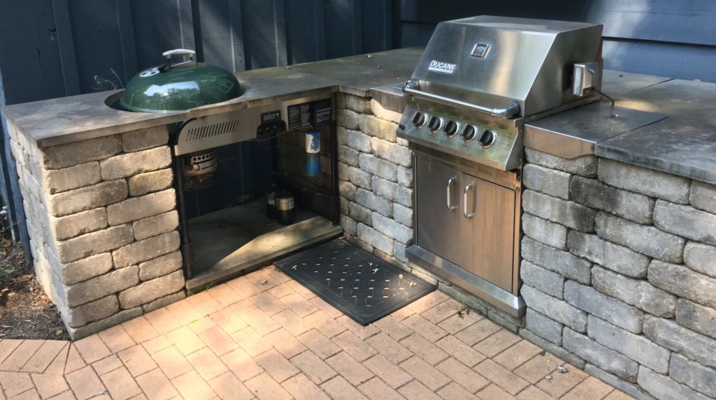 OUTDOOR KITCHEN WITH 2 GRILLS BUILT WITH UNILOCK PAVERS