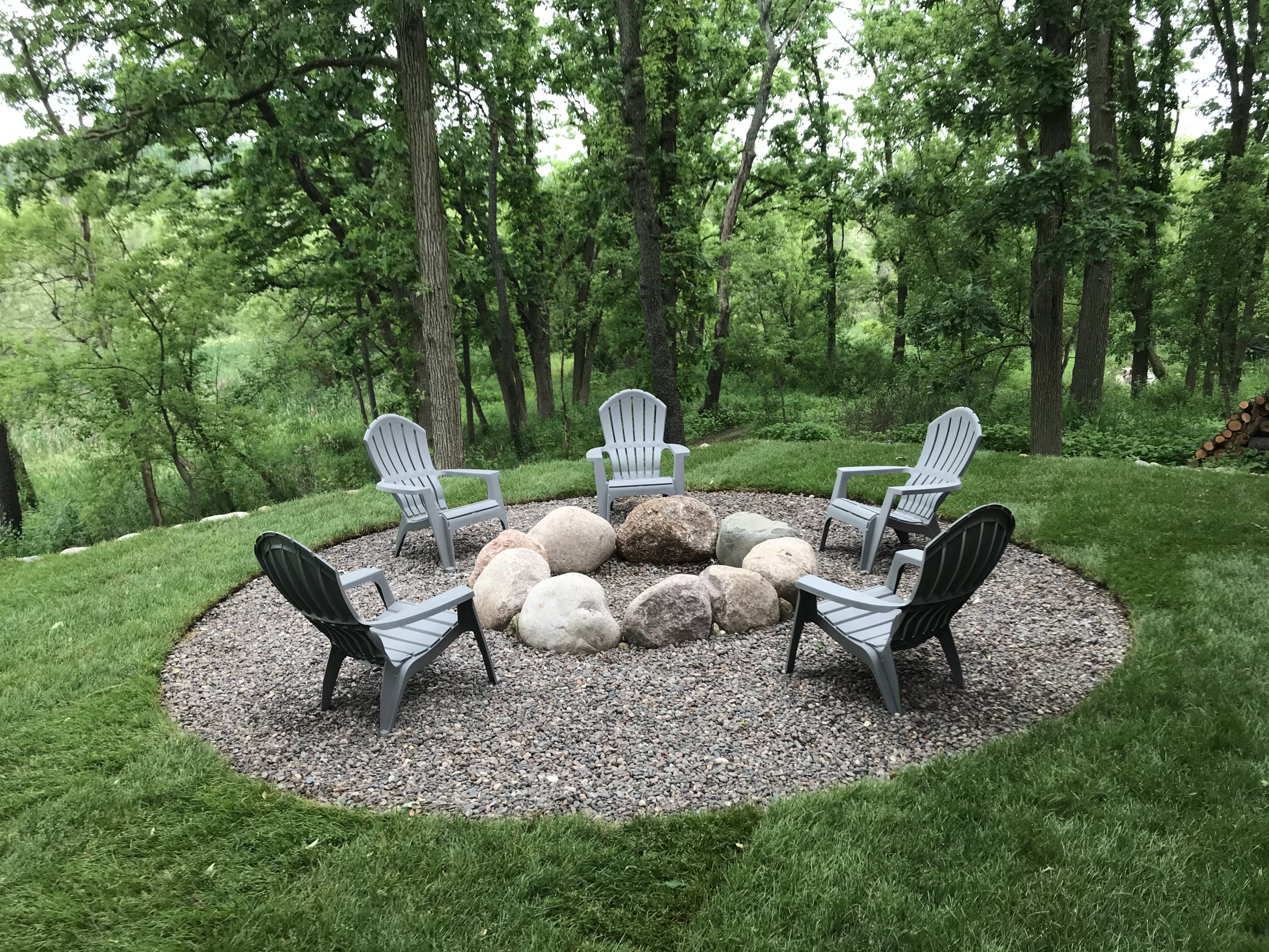 FIREPIT WITH HALF SEAT WALL UNILOCK STONE IN BARRINGTON, ILLINOIS